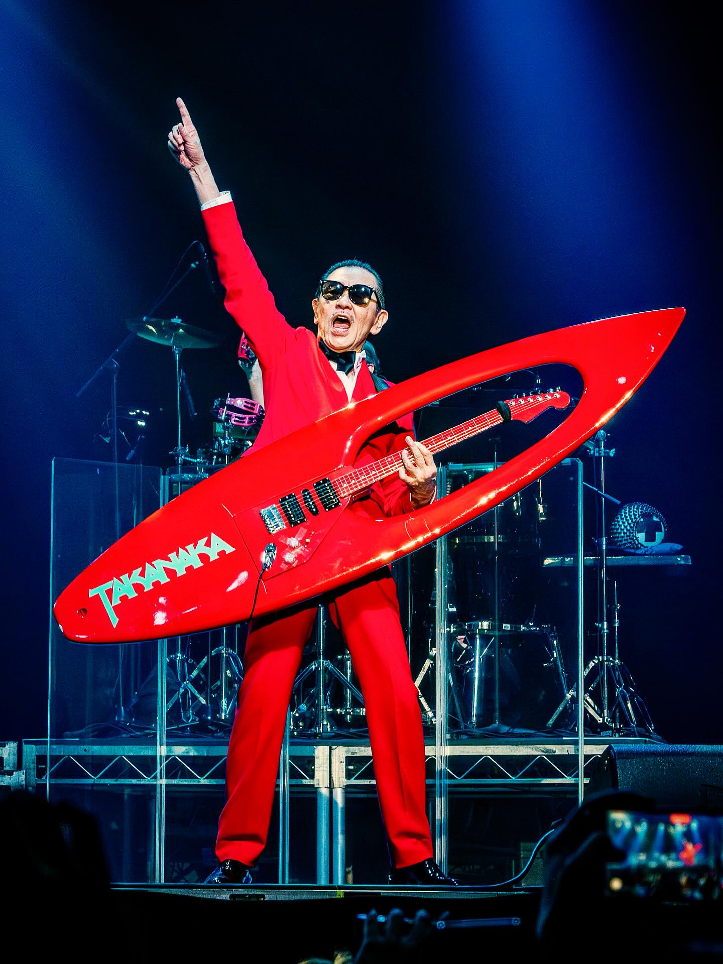 Masayoshi Takanaka performing with his surfboard guitar