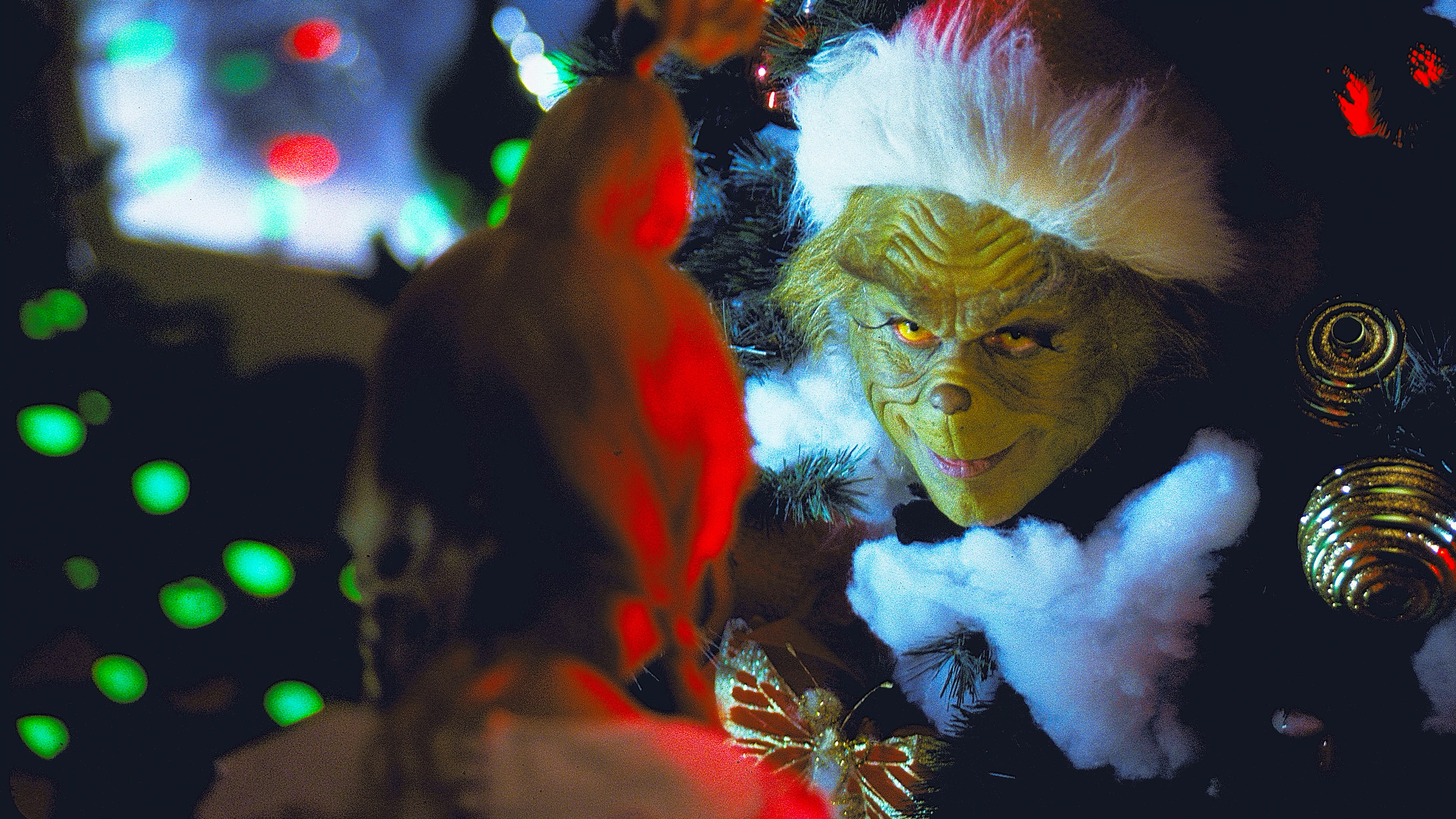 Jim Carrey as The Grinch